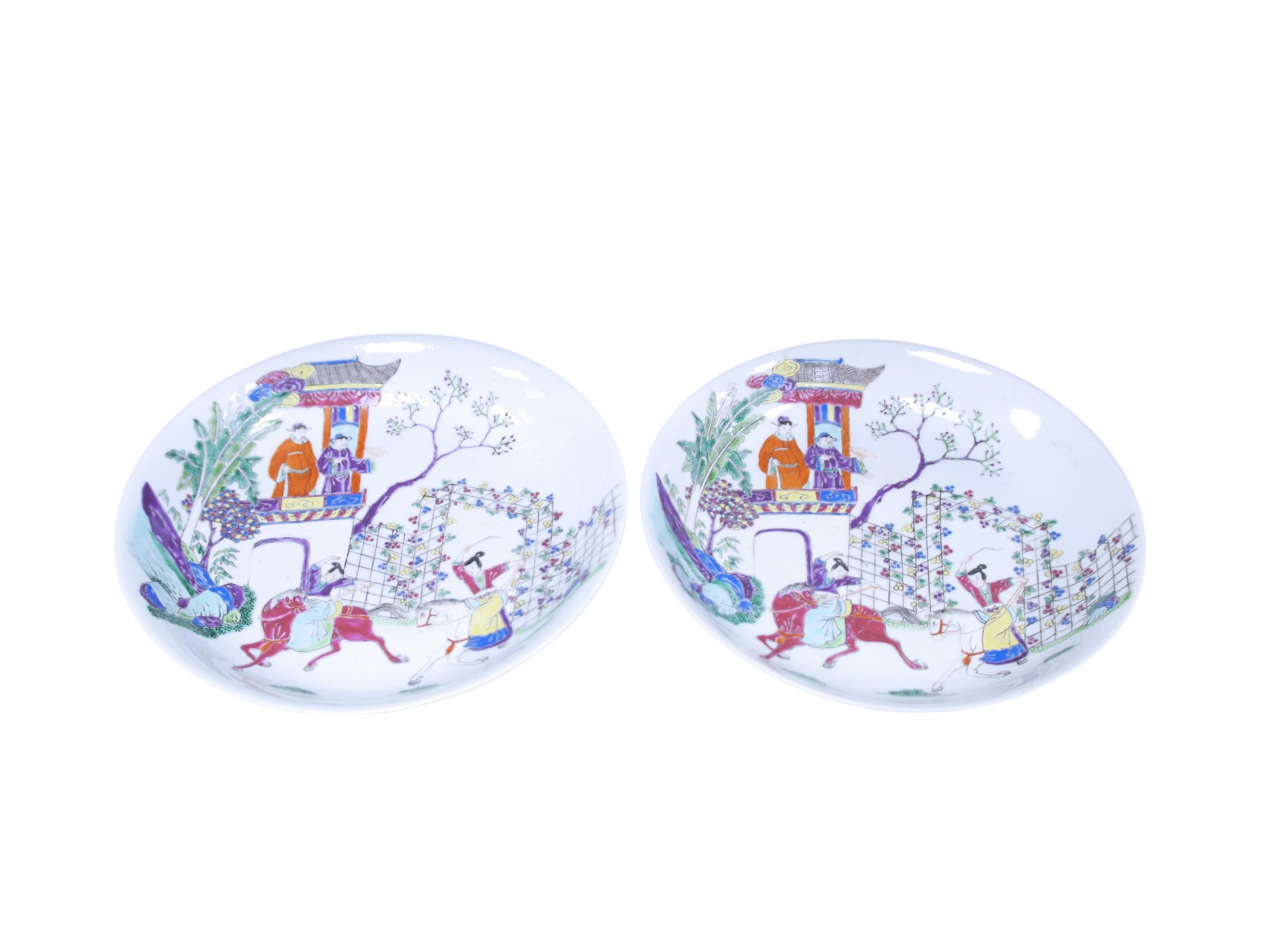 A pair of 19th century Chinese porcelain famille rose dishes, 23cm in diameter. Condition - minor hairline cracks